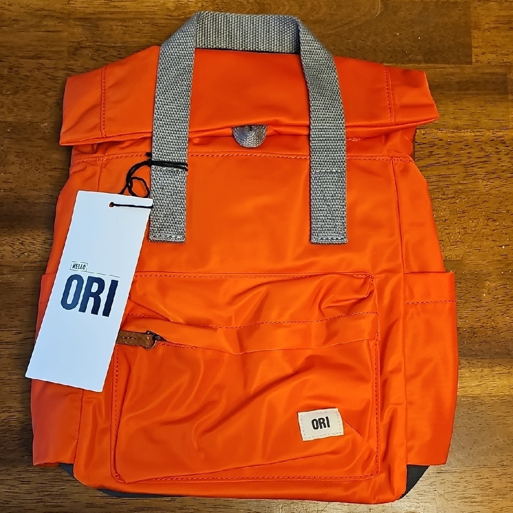 Orange Backpack with Durable Fabric and Simple Design